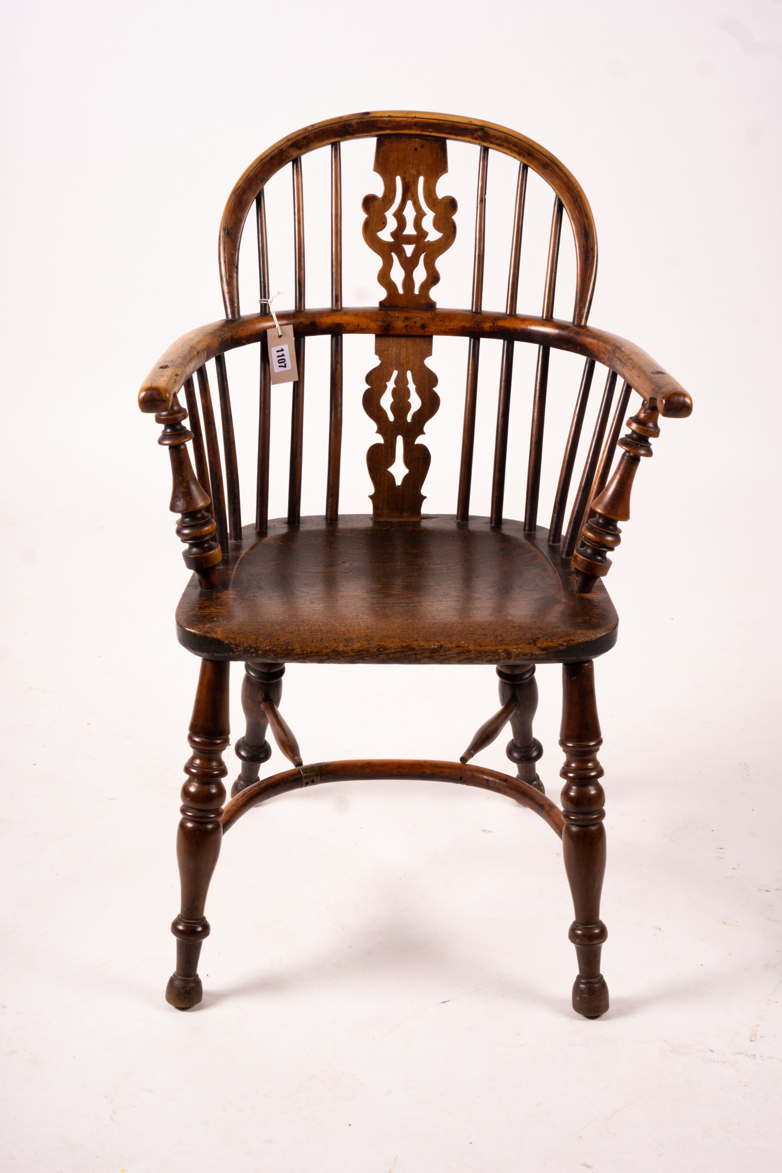 A 19th century yew and elm Yorkshire area Windsor elbow chair with crinoline stretcher, width 60cm, depth 45cm, height 93cm